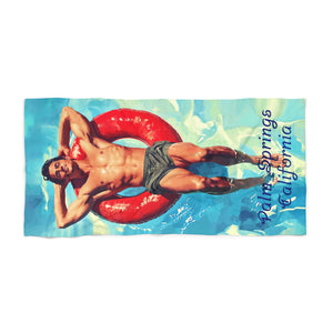 Man on a red pool float Palm Springs Beach Towel 36" x 72"